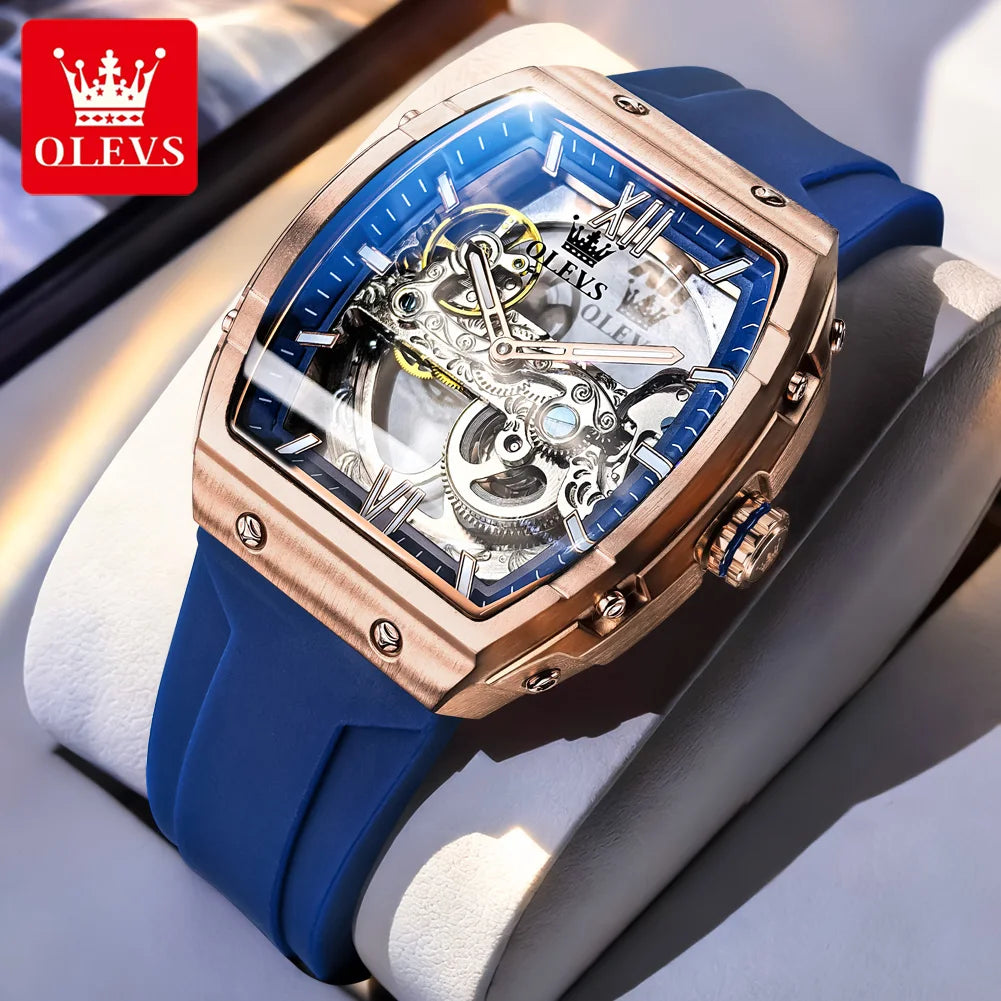 Blue and rose gold watch with OLEVS branding on a light gray background