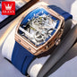 Blue and rose gold watch with OLEVS branding on a light gray background