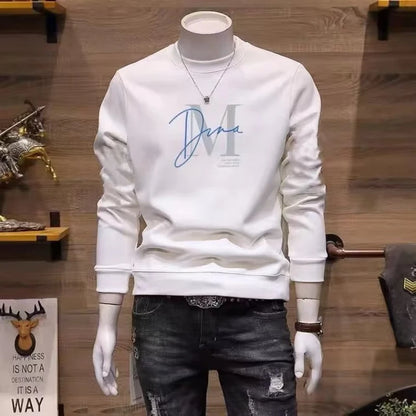 White sweatshirt with blue lettering on a mannequin against a wooden wall.