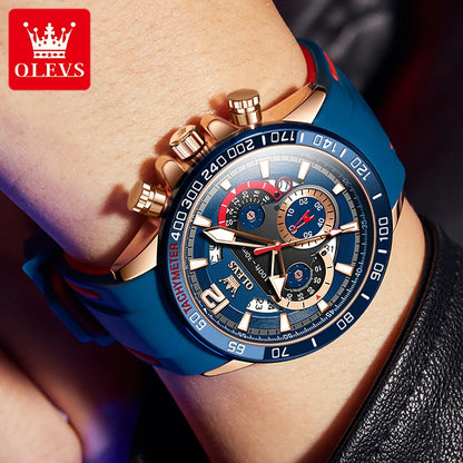 Blue and rose gold watch on a wrist with OLEVS branding.
