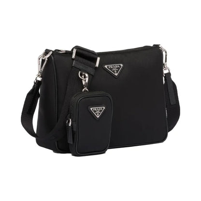 Black Prada handbag with matching pouch on a white background