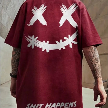 Maroon t-shirt with white graphic design and 'SHIT HAPPENS' text on a neutral background