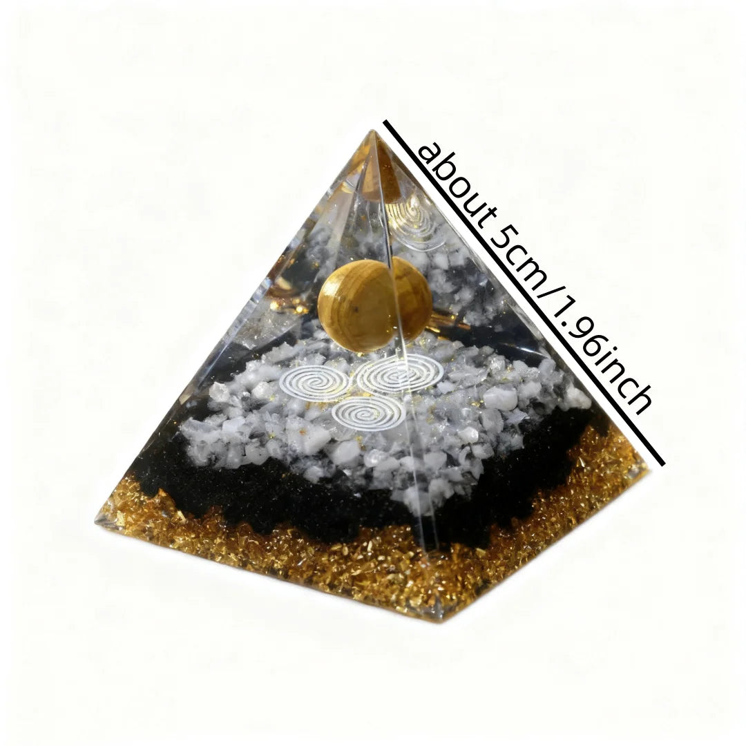 Pyramid-shaped object with gold and black colors on a white background
