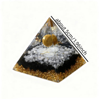 Pyramid-shaped object with gold and black colors on a white background