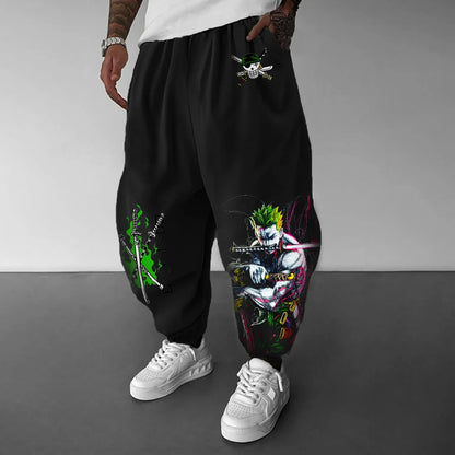 Person wearing black pants with colorful designs on a gray background