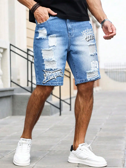 Person wearing blue ripped denim shorts with branding, standing on a sidewalk.