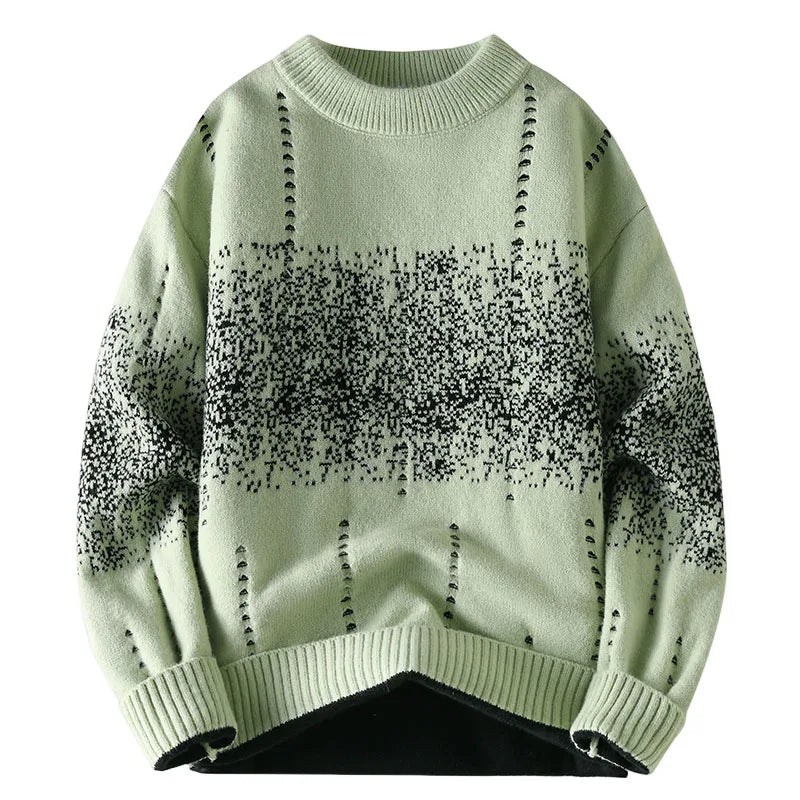 Light green sweater with black speckle pattern on a white background