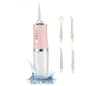 Pink dental water flosser with additional nozzles on a white background