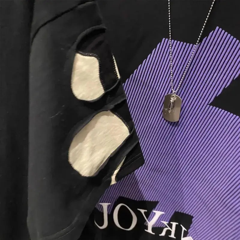 Necklace with a pendant on a black and purple textured surface