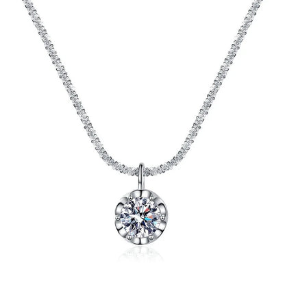 Silver necklace with a round pendant on a white background