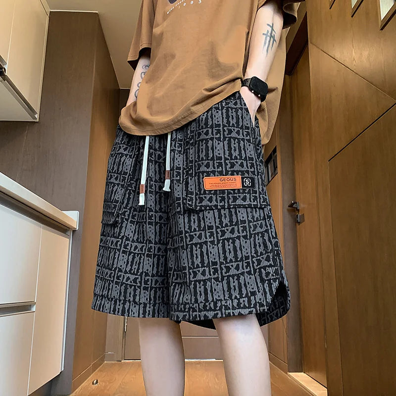 Person wearing a patterned black and gray skirt with a brand logo in an indoor setting.