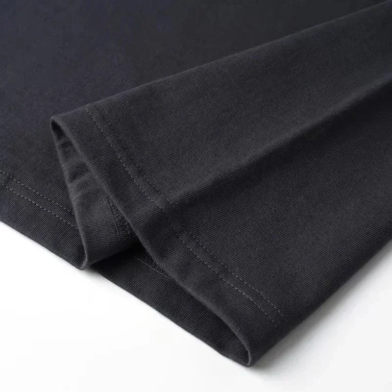 Close-up of a folded black fabric on a white background