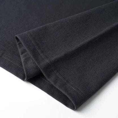 Close-up of a folded black fabric on a white background