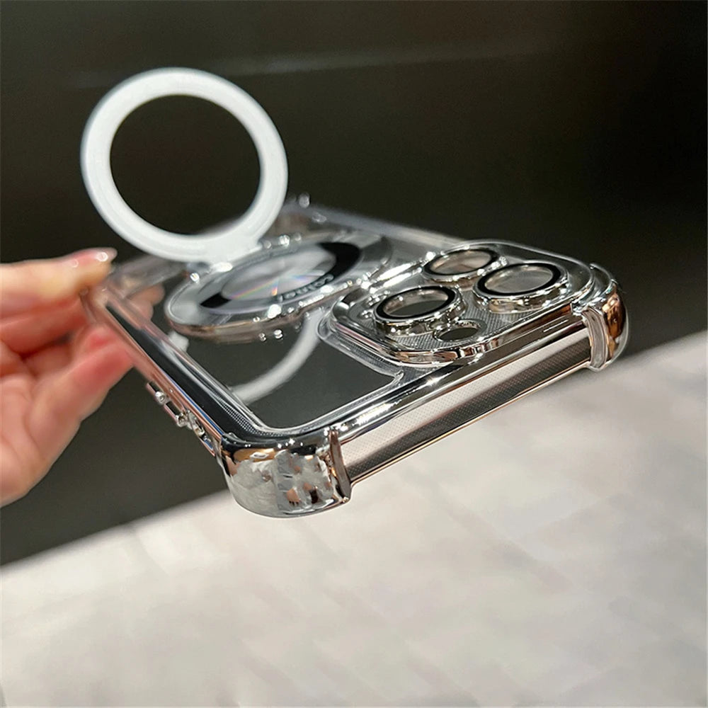 Clear phone case with metallic accents held by a hand on a light surface.