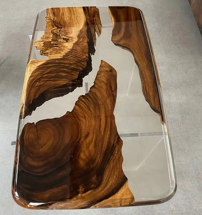 Wooden table with a clear resin overlay on a gray surface