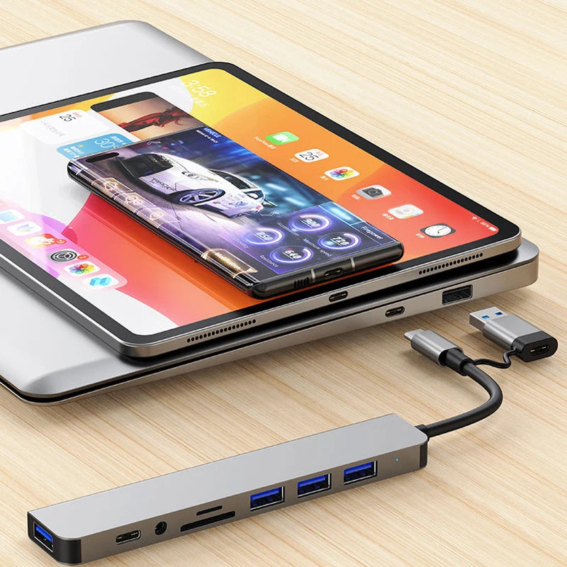 Tablet with a USB hub on a wooden surface