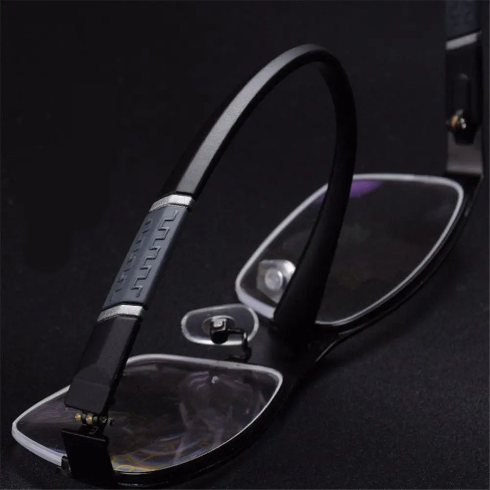 Close-up of a black eyeglasses case with a textured handle on a dark background