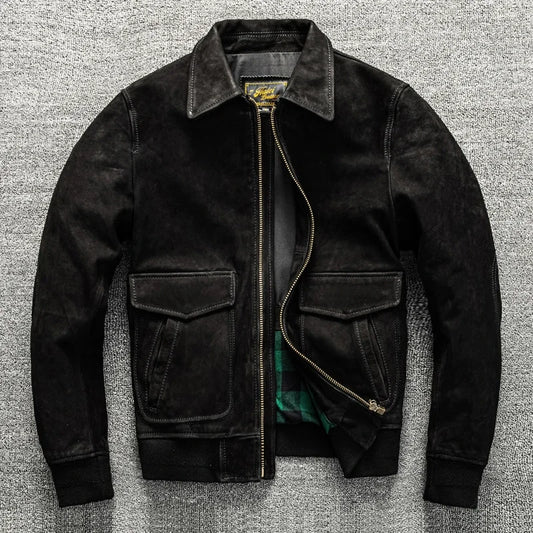 Black jacket with a zipper on a textured gray background