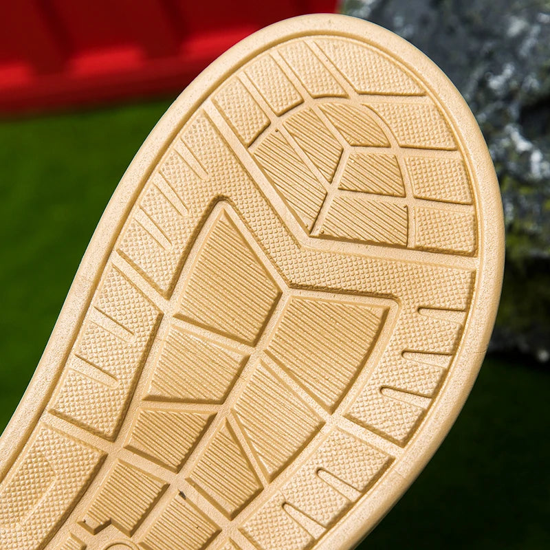 Close-up of a beige shoe sole with tread pattern on a blurred natural background