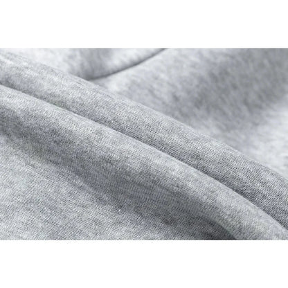 Close-up of gray fabric with folds on a white background