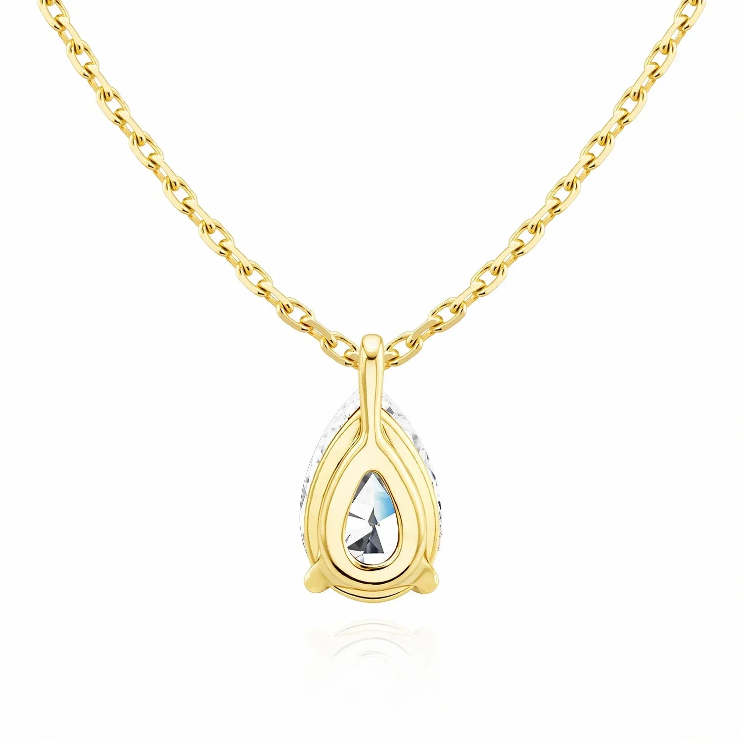 Gold necklace with a teardrop-shaped pendant on a white background