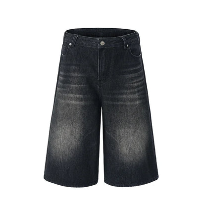 Black denim shorts on a white background