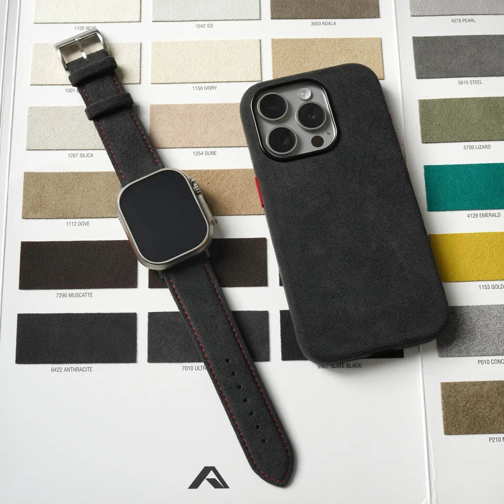 Black smartwatch and phone case on a color swatch background