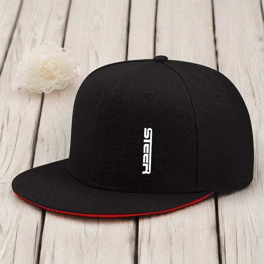 Black cap with 'Steer' logo on a wooden surface