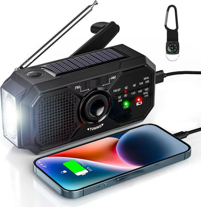 Portable radio with solar panel, flashlight, and phone charging cable on a white background