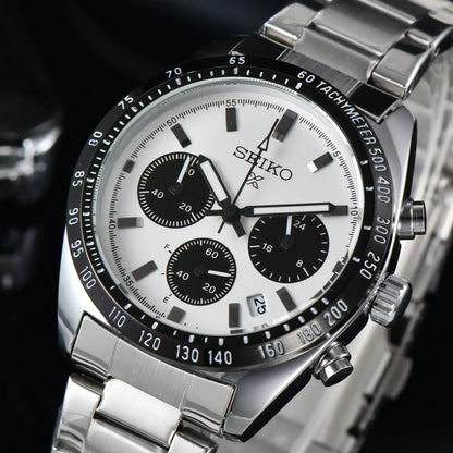 Seiko watch with silver metal strap on a dark background
