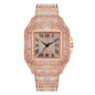 Rose gold watch with diamond-studded case on a white background