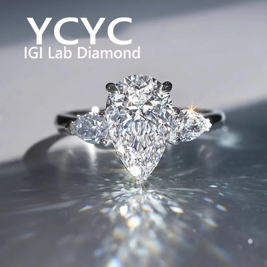 Diamond ring with 'YCYC IGI Lab Diamond' branding on a reflective surface.