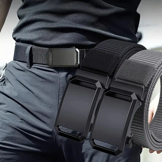 Black tactical belt with a large buckle held by a person wearing dark pants.