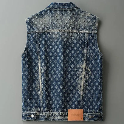 Blue denim vest with floral pattern on a gray background