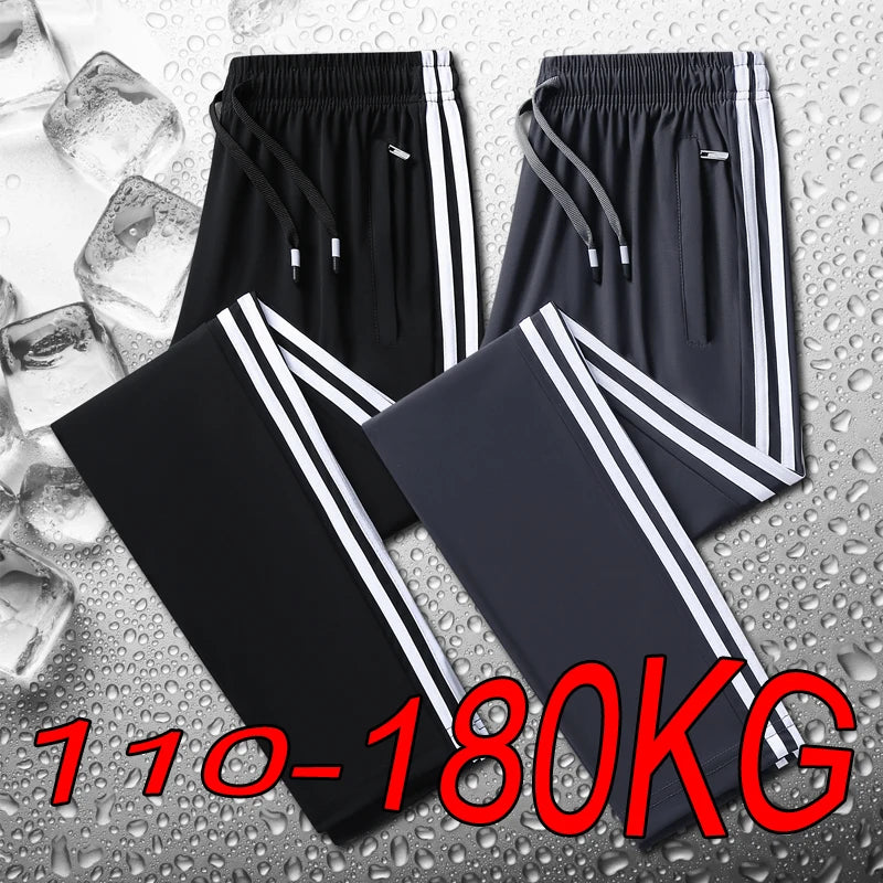 Black athletic pants with white stripes on a textured surface with ice cubes.