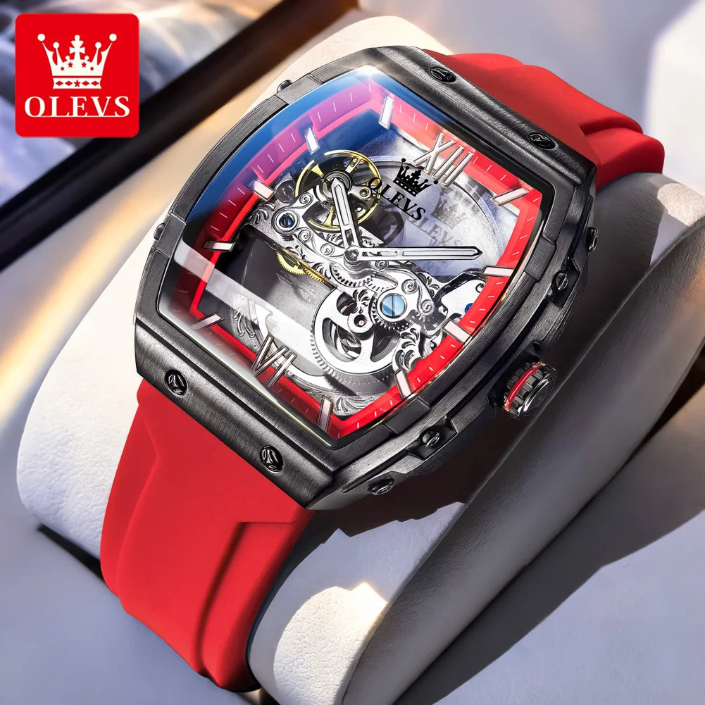 Luxury watch with red strap and visible brand logo on a light background