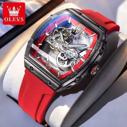 Luxury watch with red strap and visible brand logo on a light background