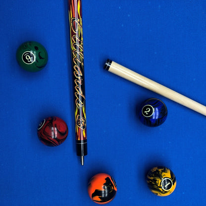 Pool balls and a cue on a blue felt background