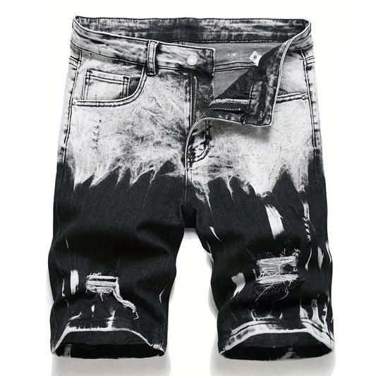 Black and white distressed denim shorts on a white background