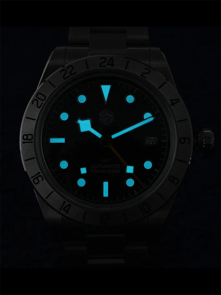 Watch with glowing blue face and markers on a black background