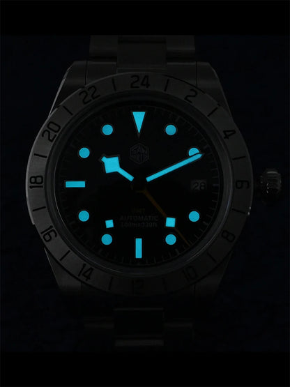 Watch with glowing blue face and markers on a black background