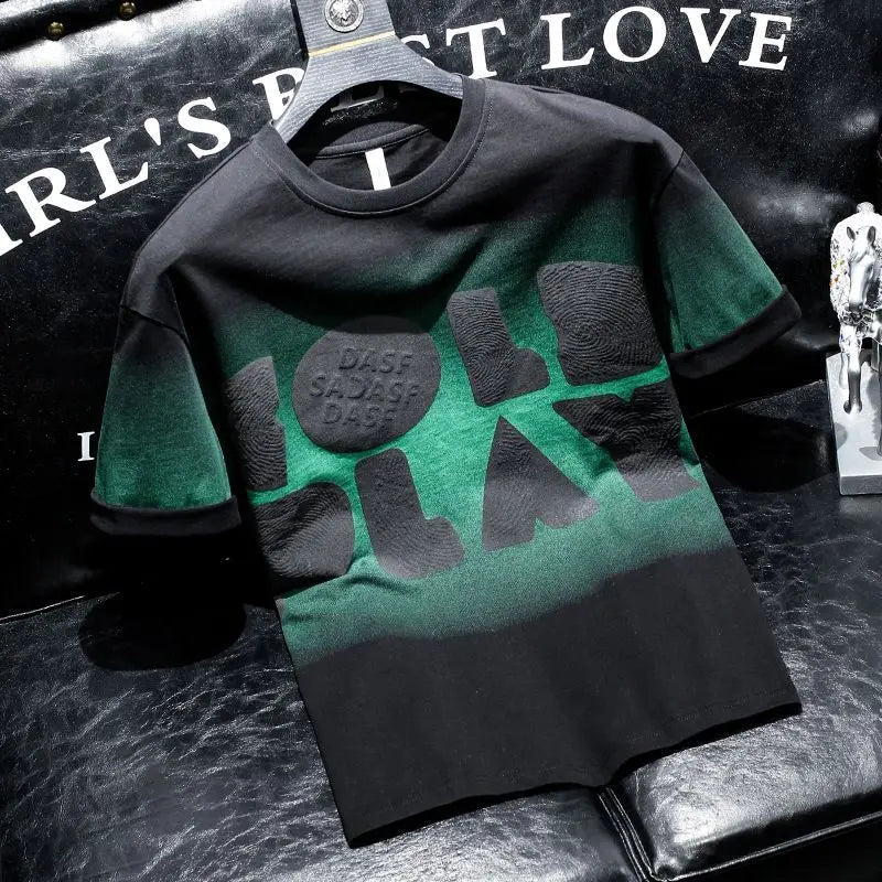 Green and black t-shirt with text on a dark textured surface