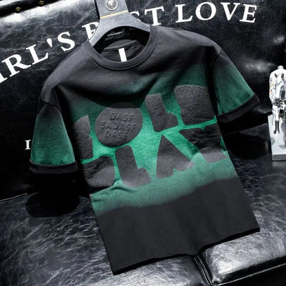 Green and black t-shirt with text on a dark textured surface