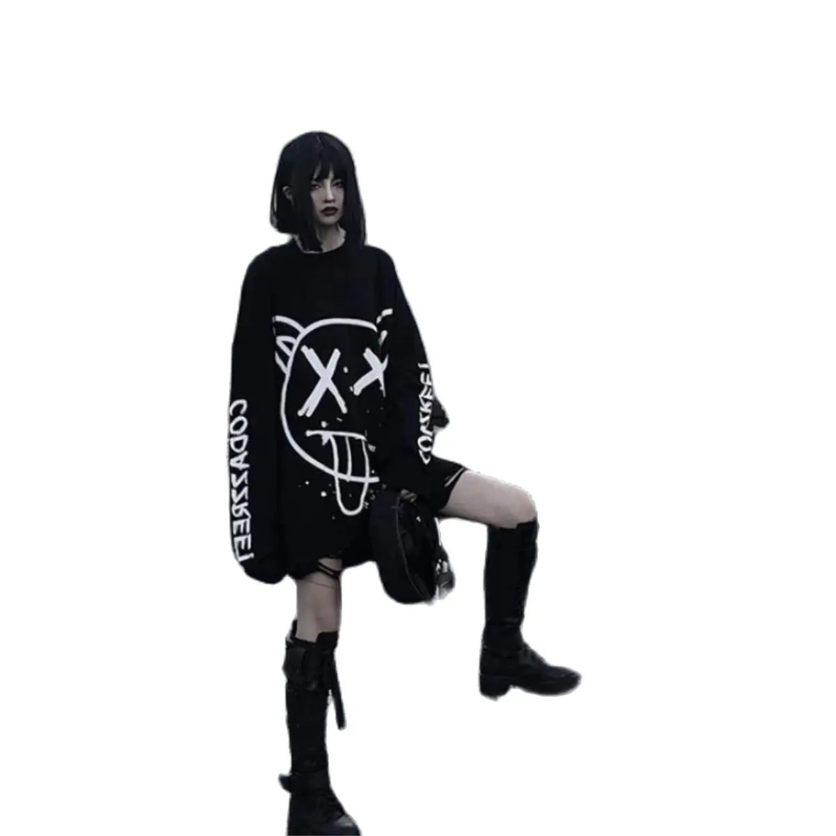 Person wearing a black oversized sweater with white designs on a white background