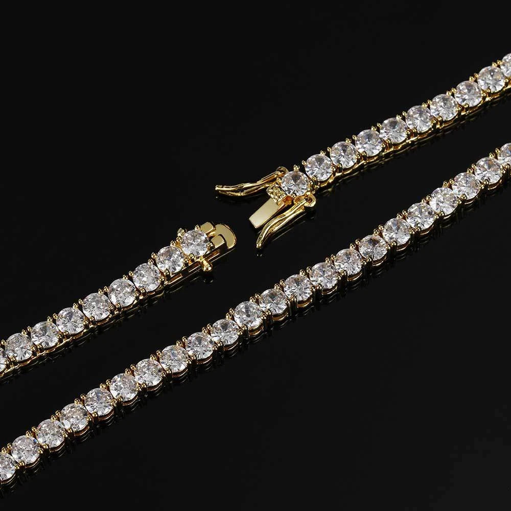 Gold bracelet with clear gemstones on a black background