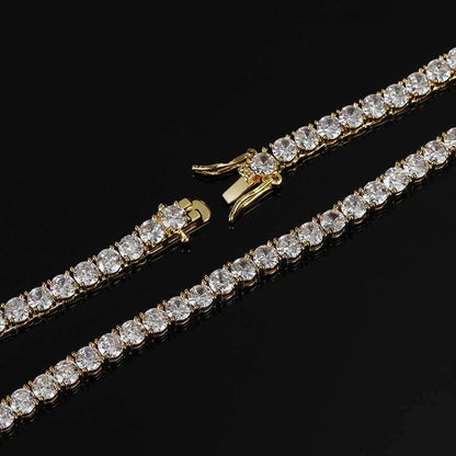 Gold bracelet with clear gemstones on a black background