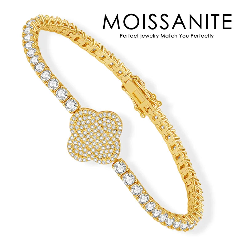Gold bracelet with clear stones on a white background, featuring the brand 'Moissanite'.