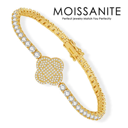 Gold bracelet with clear stones on a white background, featuring the brand 'Moissanite'.