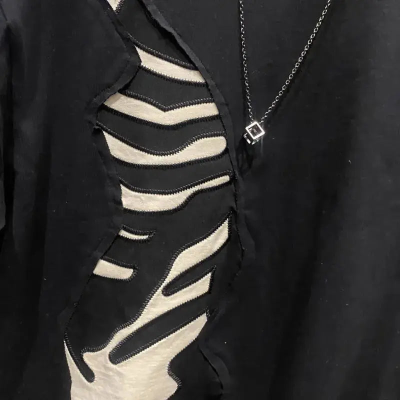 Black garment with zebra pattern design