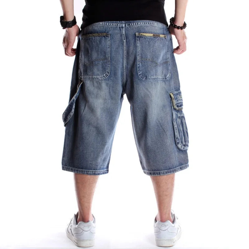 Blue denim cargo shorts worn by a person on a white background